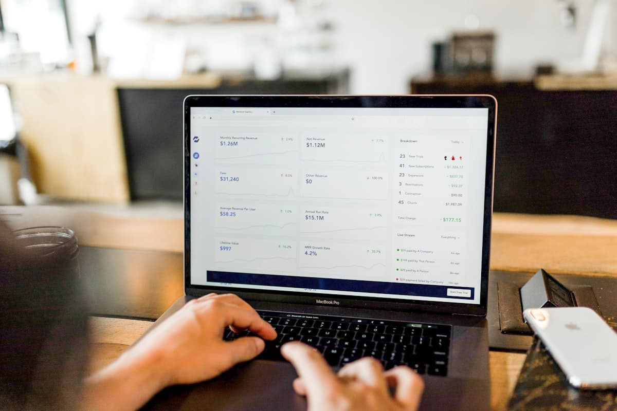 Support team handling live chat and social media messages on laptops